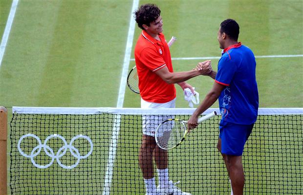 Raonic and Tsonga shake hands after setting a record for the longest third set ever at the Olympics. 